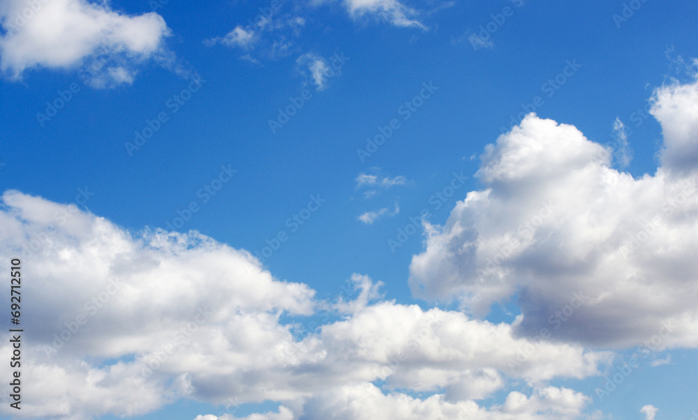Naklejka premium White clouds in blue sky
