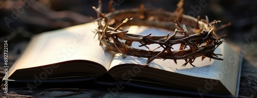 The crown of thorns of Jesus Christ lies on an open bible photo