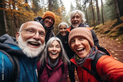 Portrait of diverse senior hikers taking selfie in woods