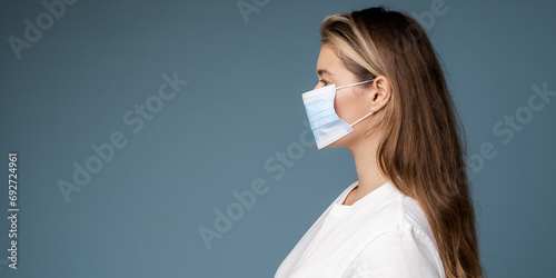 Woman looks sick wearing protection face mask.