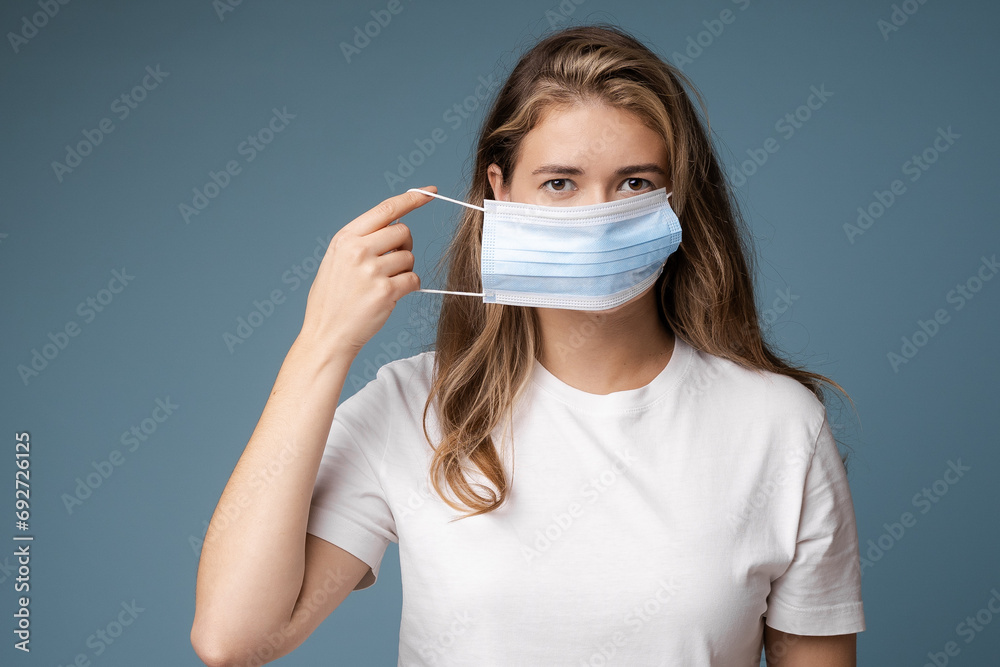 Woman looks sick wearing protection face mask. Woman looks sick wearing protection face mask.