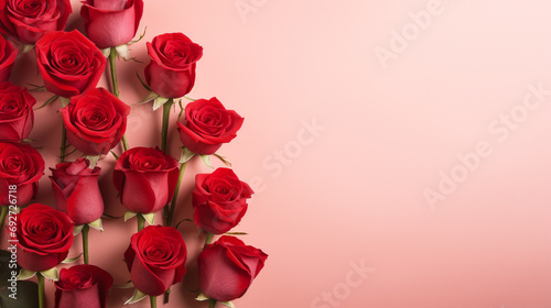 Serene top view of red roses carefully arranged on a pastel red backdrop  providing a delightful and visually appealing image with copyspace 