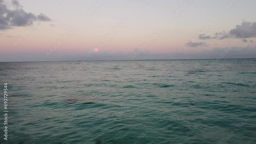 flying over Caribbean beach and waves, at sunrise on Grace Bay at Turks and Caicos Island. flying over Caribbean beach and waves, at sunrise on Grace Bay at Turks and Caicos Island.