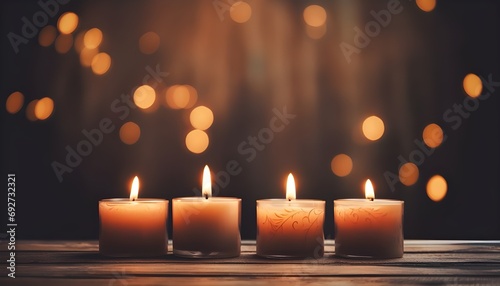 Four lit votive candles. Spirituality
