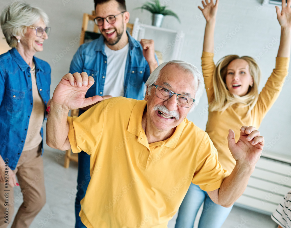 child family woman mother man father grandmother dancing music daughter