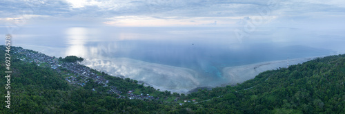 A healthy coral reef fringes the lush  tropical island of Seram  Indonesia. This remote  tropical area harbors extraordinary marine biodiversity.