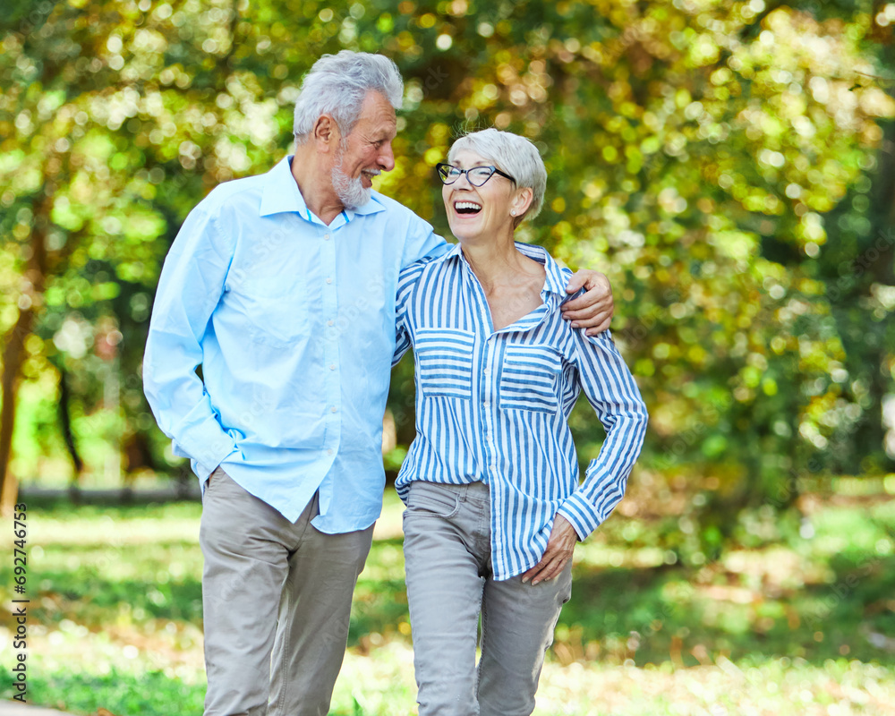 woman man senior couple happy retirement together elderly active vitality park fun smiling love old nature wife happiness mature walking holding hands