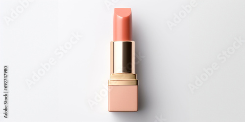 An peach fuzz color lipstick in a beige case on a white background. Make up a product show off. Copy space. photo