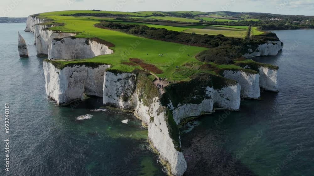 England, Beautiful aerial footage over the white cliffs, Old Harrys Rocks on the south coast of England. United Kingdom landmarks. Aerial landcape and wild nature. 