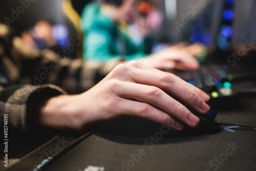 Cyber sport e-sports tournament, team of professional gamers, hands on a mouse and keyboard, players playing online championship in competitive moba, strategy fps game in a cyber games arena club