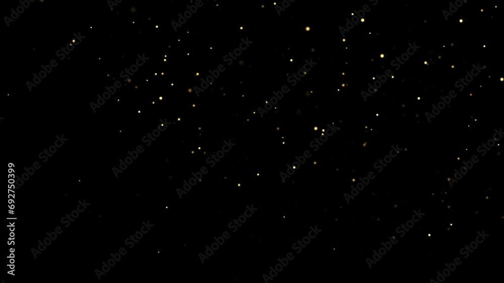 Gold dust particles fly in slow motion in the air lingering slowly.