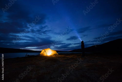 Iluminated tent at night in Norway photo