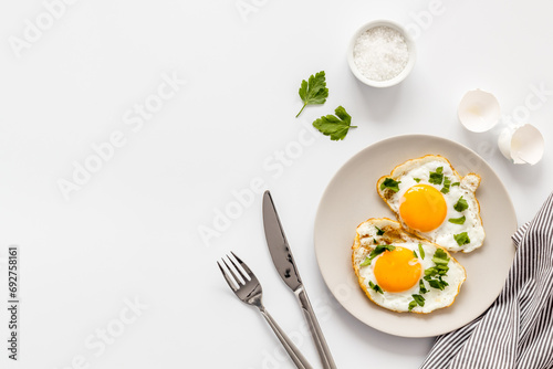 Cooking fast breakfast with fried eggs, top view. Food background