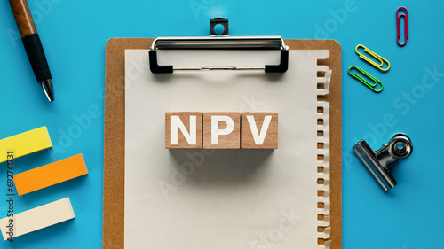 There is notebook with the word NPV. It is an abbreviation for Net Present Value as eye-catching image. photo