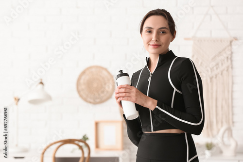 Sporty young woman with wat...