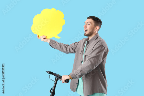 Young man with blank speech...
