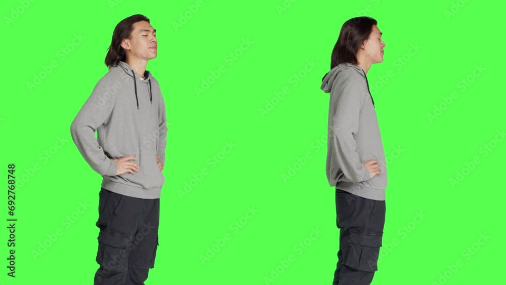 Person feeling exhausted and yawning after not sleeping enough, posing with fatigue and low energy over greenscreen. Young guy being extremely sleepy and tired, falling asleep standing. Person feeling exhausted and yawning after not sleeping enough, posing with fatigue and low energy over greenscreen. Young guy being extremely sleepy and tired, falling asleep standing.