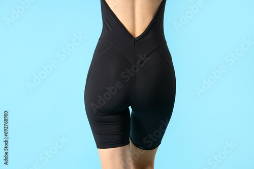 Young woman in cycling jump...