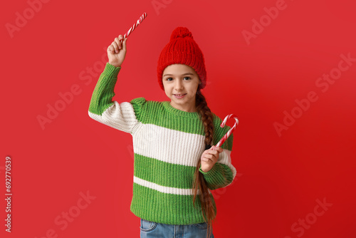 Cute little girl in warm ha...