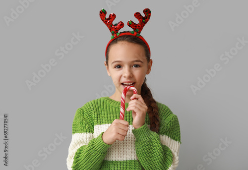 Cute little girl in reindee...