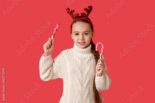 Cute little girl in reindee...