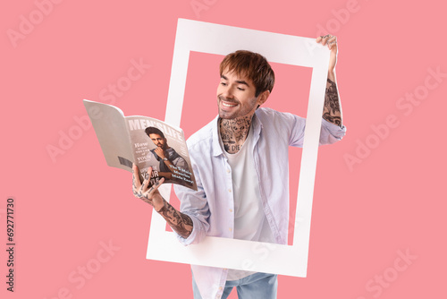 Tattooed young man with fra...