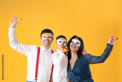 Happy family in carnival ma...
