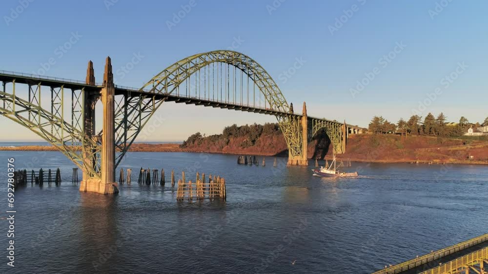 Aerial Drone Video- Yaquina Bay Bridge Sunrise- Newport Oregon- Slow dolly-in shot of Fishing boat departing V07 Aerial Drone Video- Yaquina Bay Bridge Sunrise- Newport Oregon- Slow dolly-in shot of Fishing boat departing V07