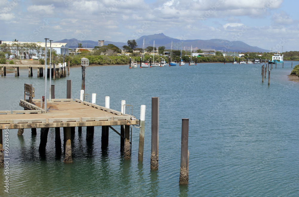 Jetty pier with the ocean and boats in Gladstone, Queensland, Australia