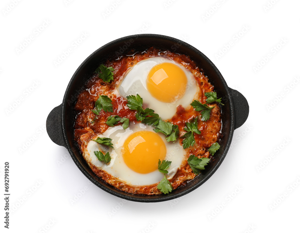 Delicious shakshuka in frying pan isolated on white, top view Delicious shakshuka in frying pan isolated on white, top view