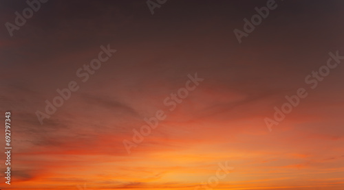 Twilight in the Evening with Orange Gold Sunset  Real amazing panoramic sunrise or sunset sky with gentle colorful clouds. Nature background  Sky background.