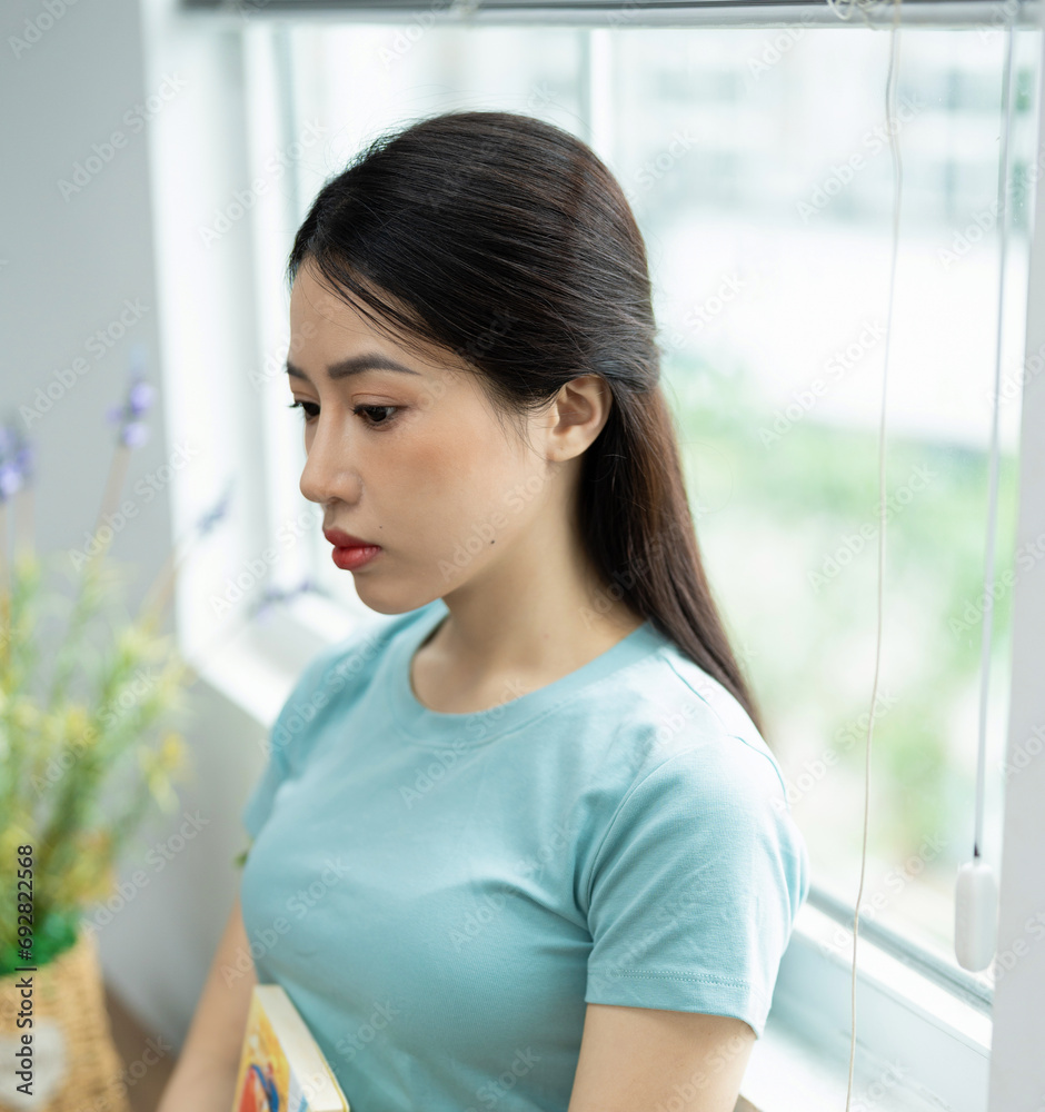 Photo of young Asian woman at home Photo of young Asian woman at home