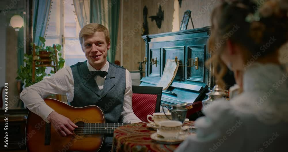 middle-aged man playing guitar and singing romantic song for lady, 19th century, 4K, Prores middle-aged man playing guitar and singing romantic song for lady, 19th century, 4K, Prores