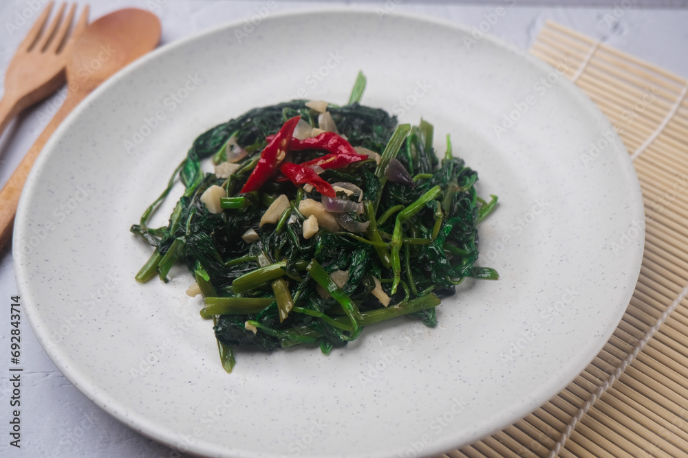 Cah kangkung or stir fried water spinach