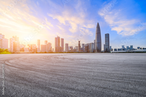 Asphalt road and urban skyline with modern buildings at sunset in Shenzhen, China. © ABCDstock