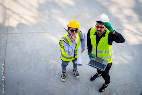 Engineer inspect building structure technicians looking at analyzing unfinished construction project