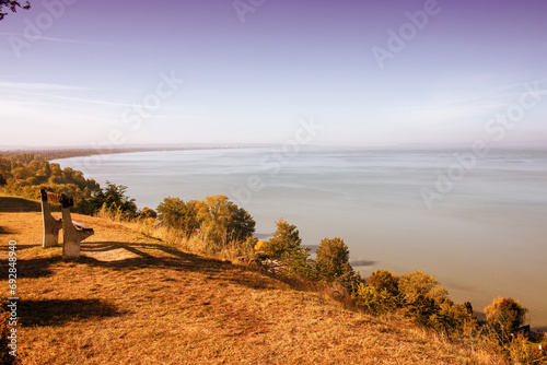 Bench on the hill,View of the Balaton lake from Balatonvilagos.Autumn season. photo