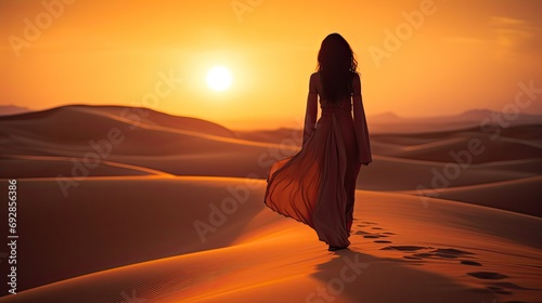 silhouette of beautiful arabic woman walking on the san