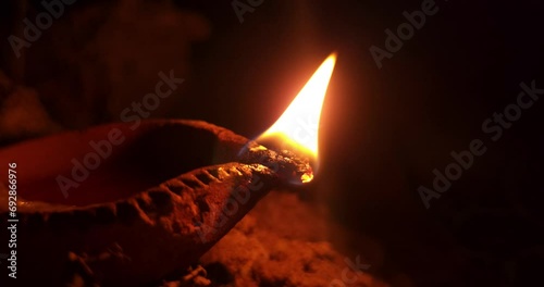Decorative colourful Traditional diya lamp lit during celebration. Outdoor photo