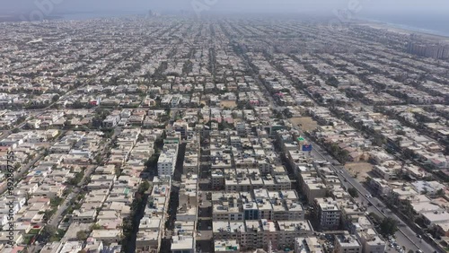 Aerial footage of the cityscape of Karachi the capital of Sindh Province on a sunny day, Pakistan photo