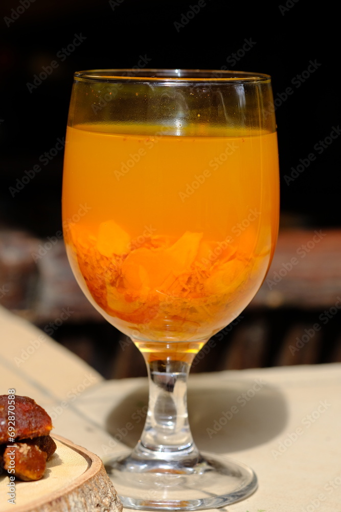 Jamu Kunir Asem is is a traditional Javanese herbal drink made from turmeric, tamarind, brown sugar, and water. This yellow drink is believed to have health benefits and can boost the immune system. Jamu Kunir Asem is is a traditional Javanese herbal drink made from turmeric, tamarind, brown sugar, and water. This yellow drink is believed to have health benefits and can boost the immune system.