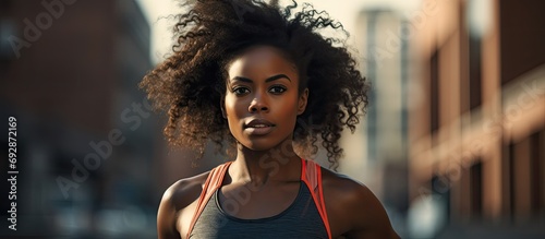 Black woman runner starting a fitness race in the city for exercise and training.