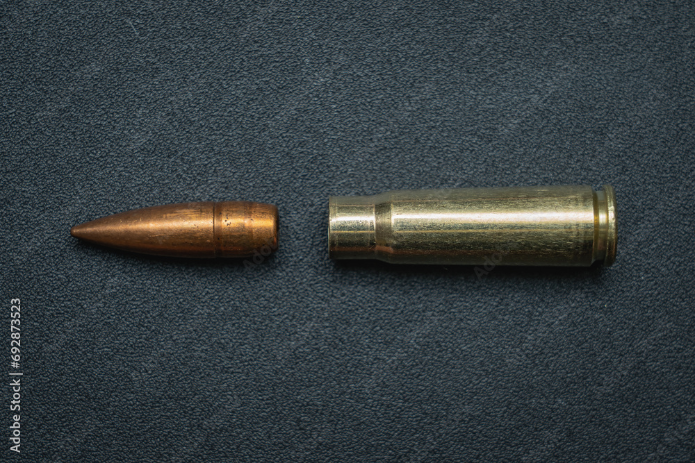 Disassembled 7.62x39mm caliber cartridge. Bullet and cartridge case from a rifle. Disassembled 7.62x39mm caliber cartridge. Bullet and cartridge case from a rifle.