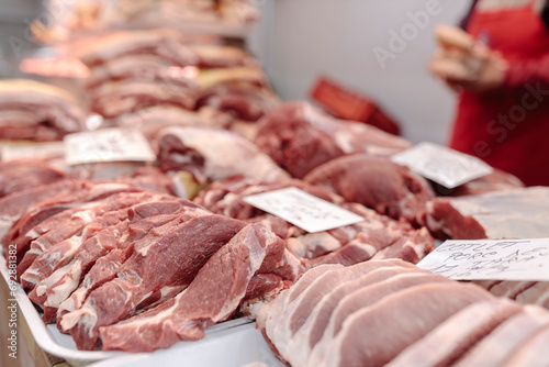 A Variety of Fresh Raw Meats Displayed on a Table in Obor Fisher Market photo