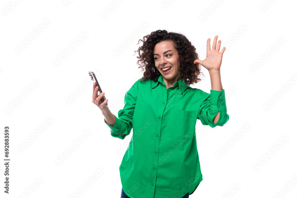 young creative agent woman with curly hair dressed in green shirt smiling with teeth young creative agent woman with curly hair dressed in green shirt smiling with teeth