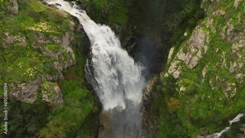 Fervenza do Toxa Waterfalls, Spain. Massive Cascades Over Steep Rock Mountains. Aerial Shot photo