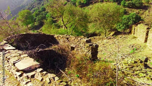 the ruins of an old village at the top of the mountain in Algeria photo