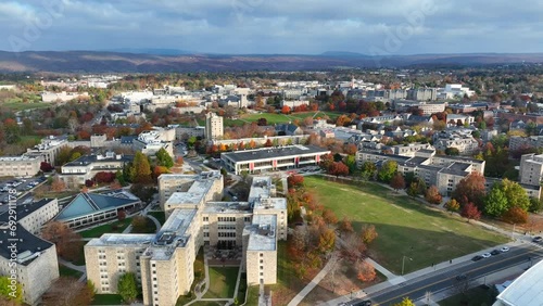 Wide aerial shot of Virginia Tech college campus in Blacksburg, VA during autumn. High drone establisher. photo
