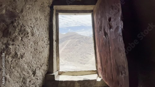 View from wood window frame of Altit fort of Hunza valley in Pakistan photo