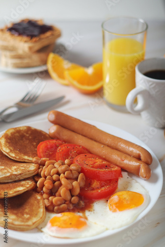 Traditional British breakfast with sausages and beans	
